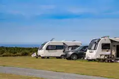 Caravans on electric grass pitches with sea views at St Agnes Caravan Site
