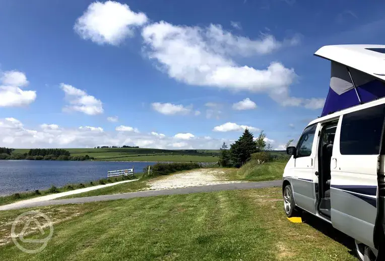 View of the lake with a camper van, by Sharon Stevens