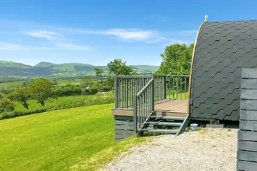 Ensuite pod with hot tub outdoor decking and view