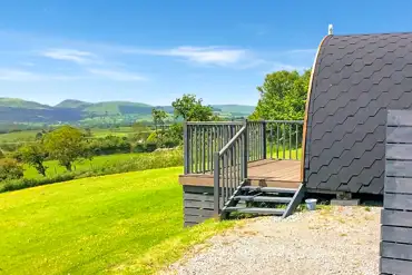 Ensuite pod with hot tub outdoor decking and view