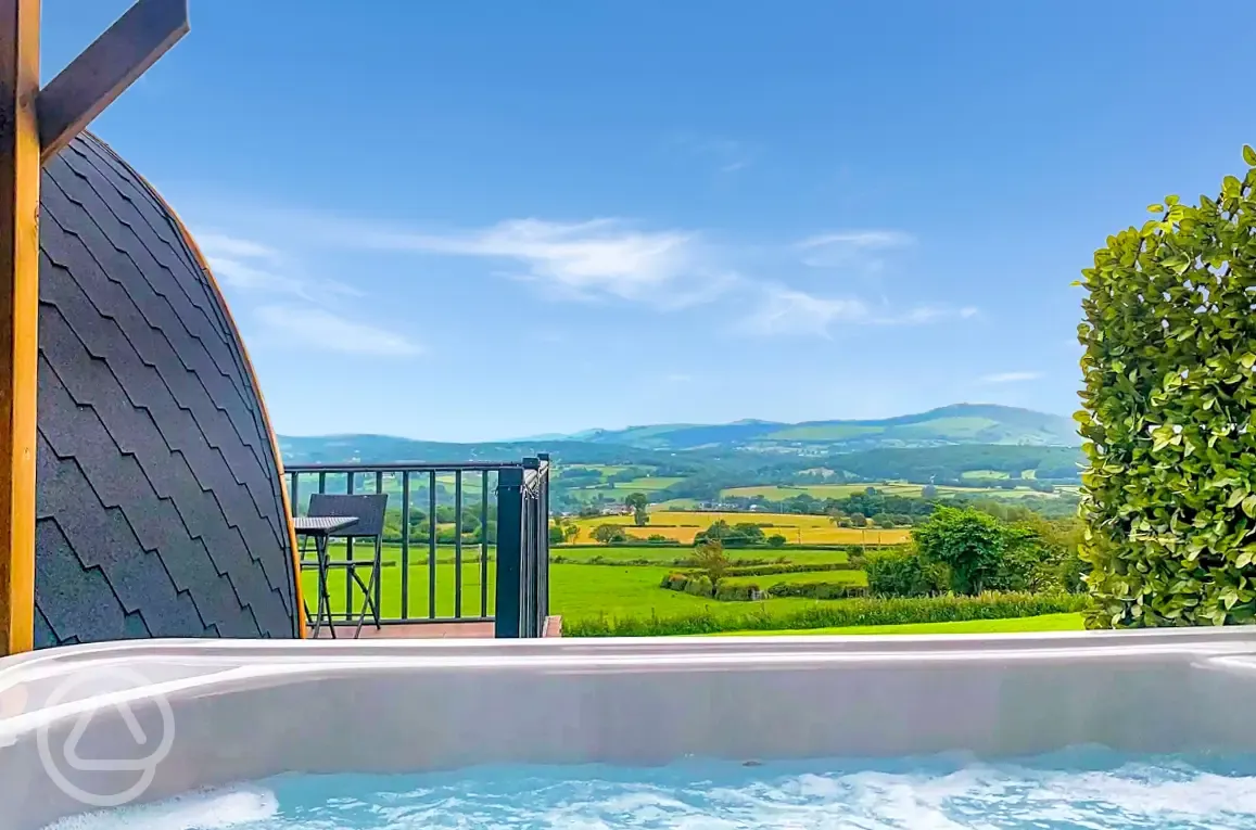 Ensuite pod with hot tub outdoor decking and view