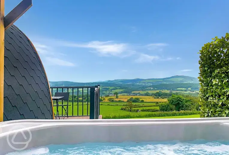 Ensuite pod with hot tub outdoor decking and view