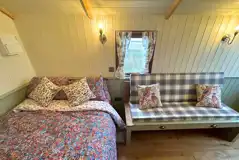 Shepherd's hut double bed and double sofa bed