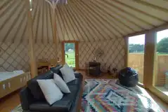 7m luxury European yurt sofa and wood-burner with rug furnishings 7m luxury European yurt sofa and wood-burner with rug furnishings