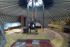 Traditional Mongolian yurt interior with furnishings Traditional Mongolian yurt interior with furnishings