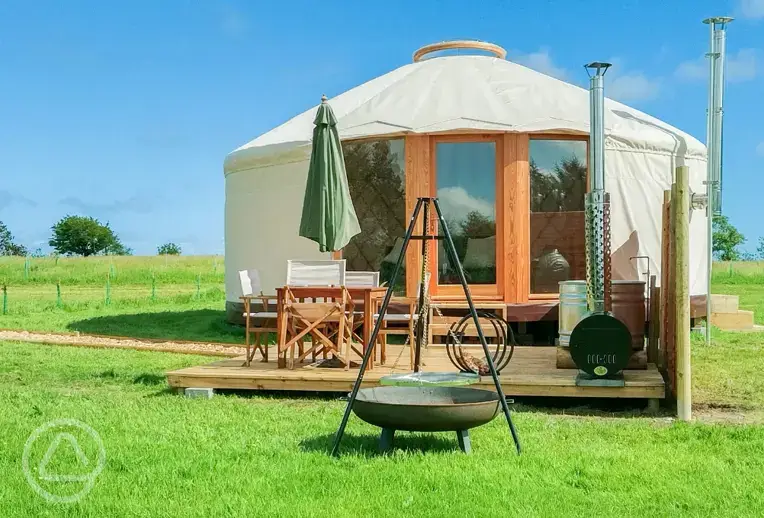 6m luxury European yurt with an outdoor wood-fired tub and furniture