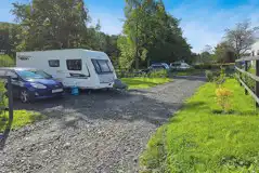 Electric hardstanding pitches with space for a car alongside