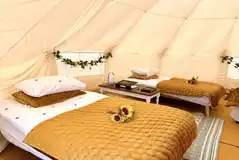 Bell tent interiors with single beds Bell tent interiors with single beds