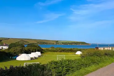 Bell tents overlooking the coast at Beachside Glamping Dale