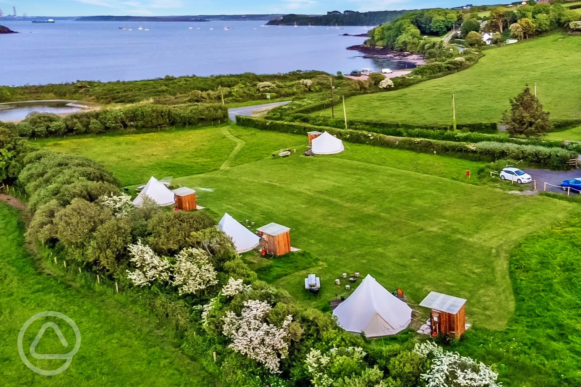 Aerial of the bell tents by the coast