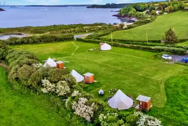 Aerial of the bell tents by the coast