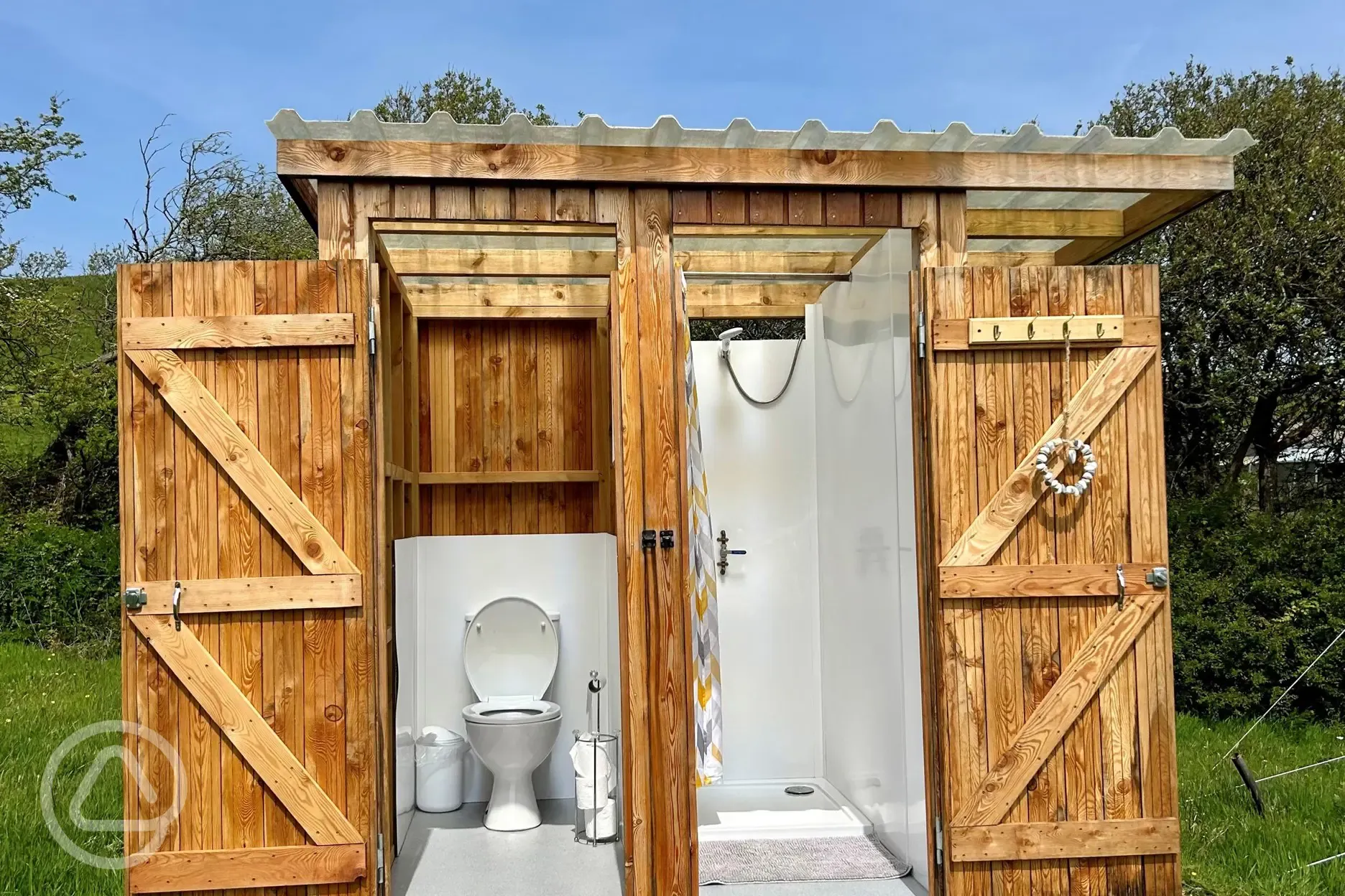 Private toilet and shower for each bell tent