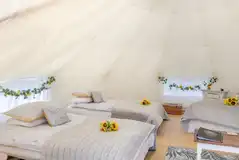 Bell tent interiors with furnishings and bedding provided Bell tent interiors with furnishings and bedding provided