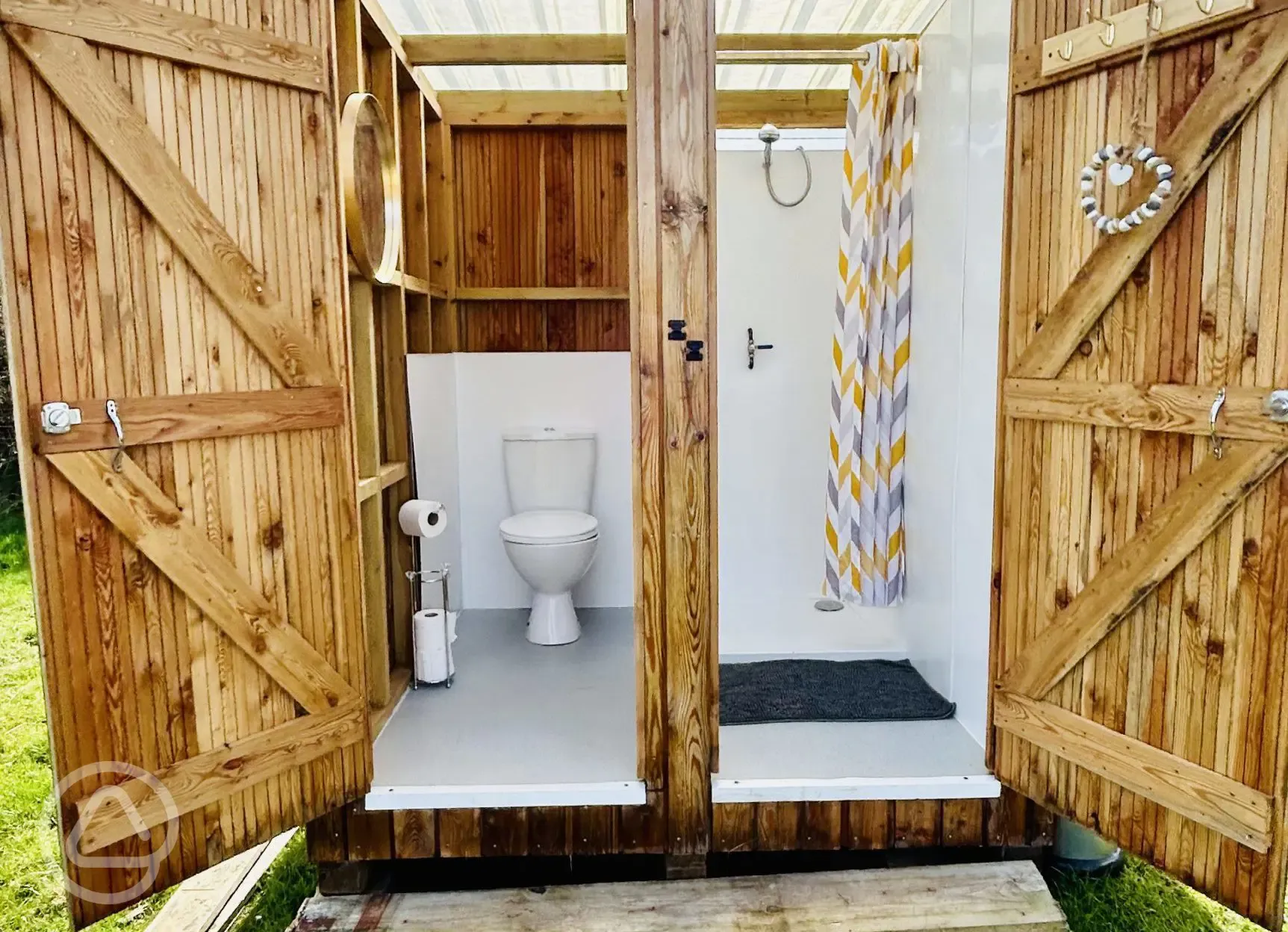 Private toilet and shower for each bell tent