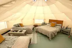Bell tent interiors with double and single beds available Bell tent interiors with double and single beds available