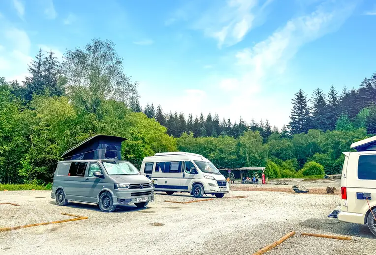 Electric hardstanding pitches at Nevis Range with wooden boundaries