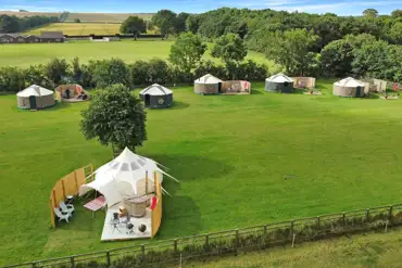 Aerial of Wold Meadow yurts and stargazer bell tent 
