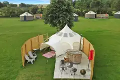 Aerial of stargazer bell tent with hot tub and outdoor seating Aerial of stargazer bell tent with hot tub and outdoor seating