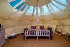 Stargazer bell tent interior with king size bed (bedding and towels provided) Stargazer bell tent interior with king size bed (bedding and towels provided)