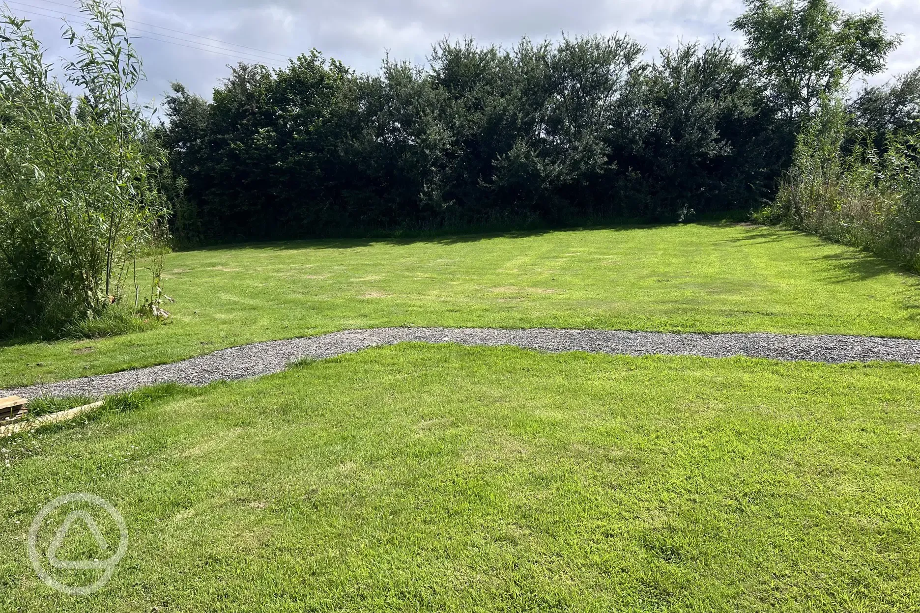 Ensuite grass and hardstanding camping pitch and wild spa