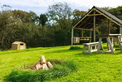 Ensuite grass pitches with fire pits and undercover dining areas Ensuite grass pitches with fire pits and undercover dining areas