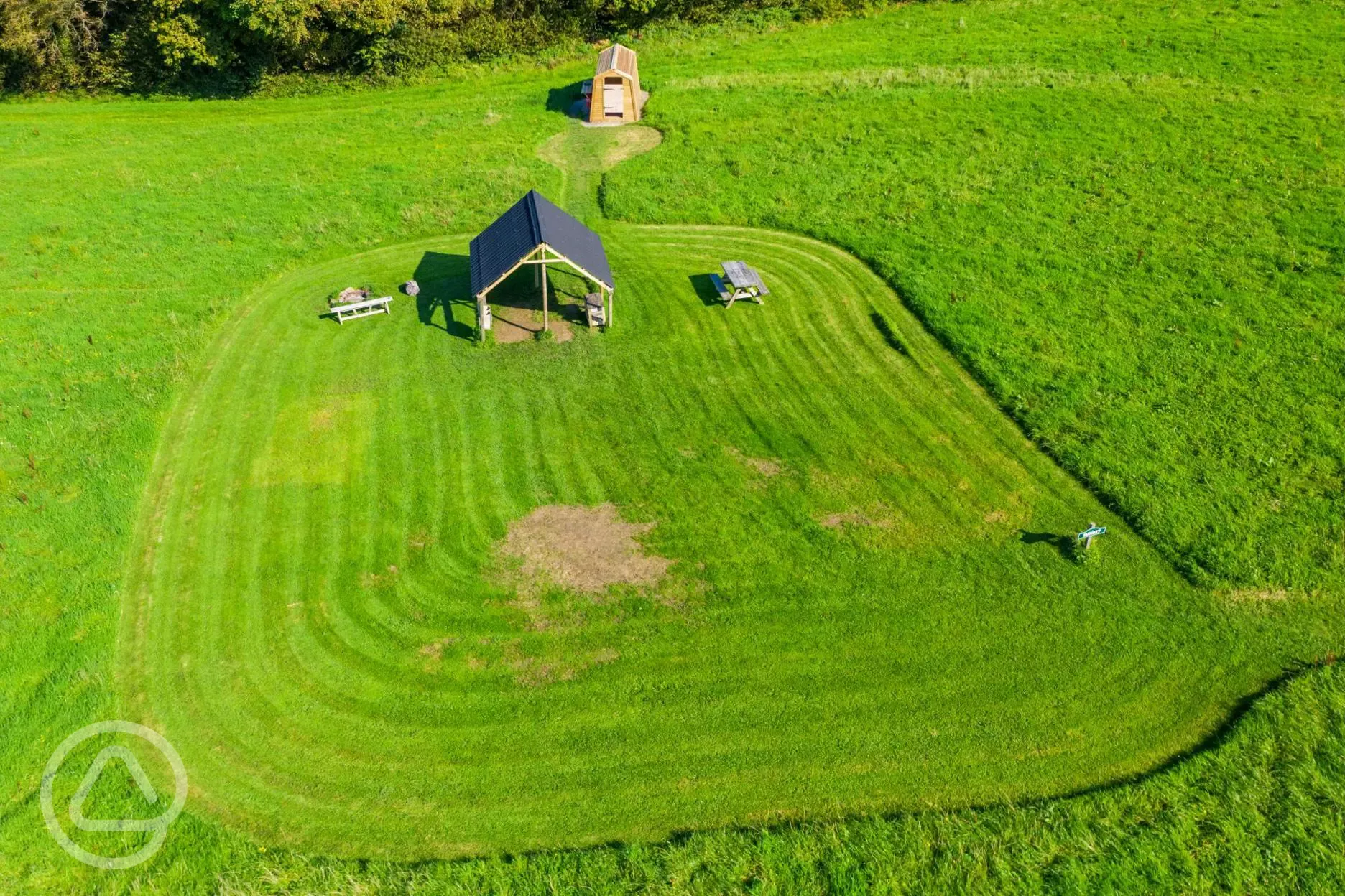 Ensuite grass pitches with undercover dining areas