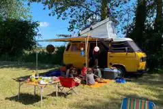 Goldstone Camping non electric grass pitch with a campervan