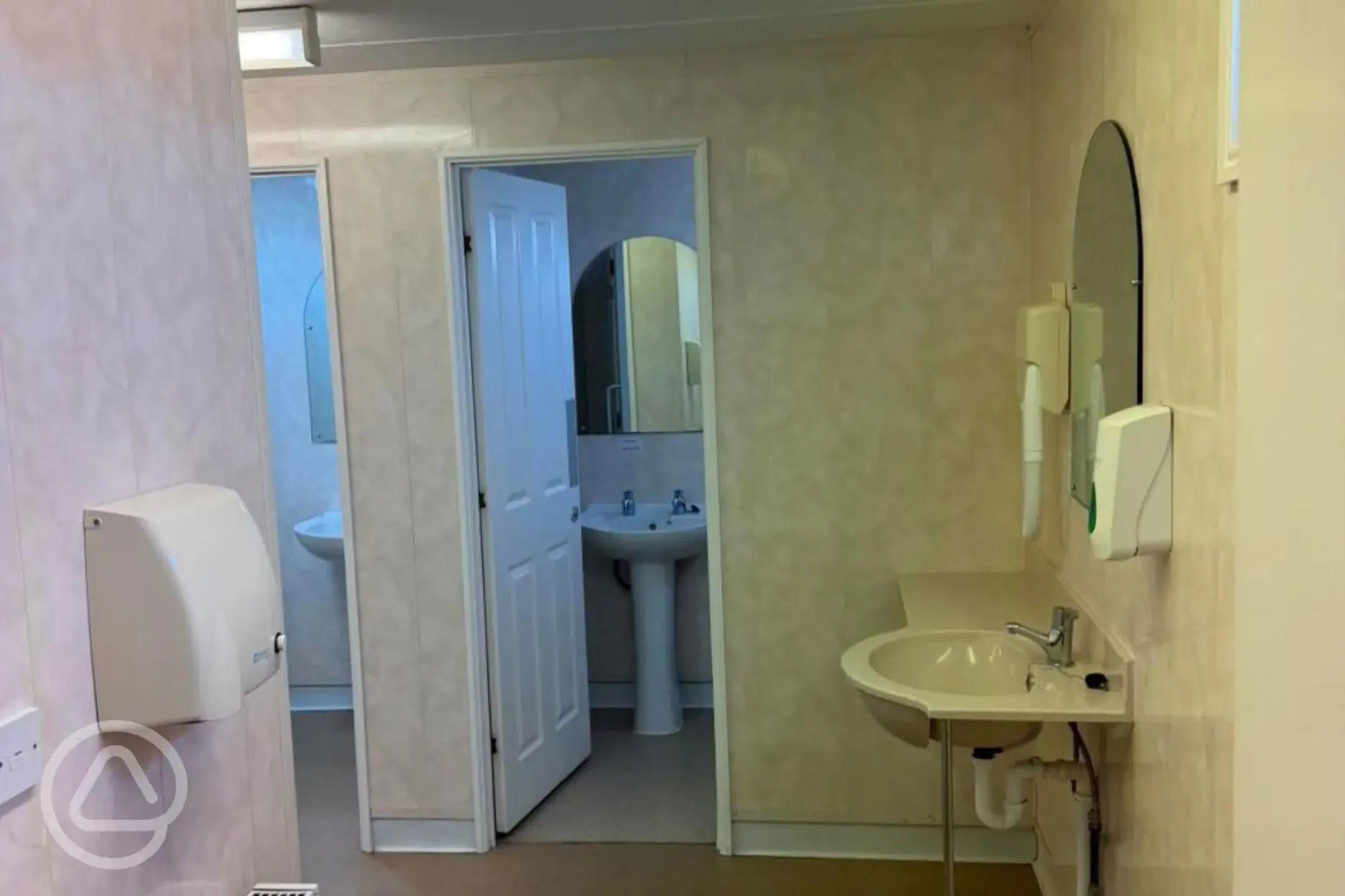 Toilets with mirrors, sinks and hand dryers Toilets with mirrors, sinks and hand dryers