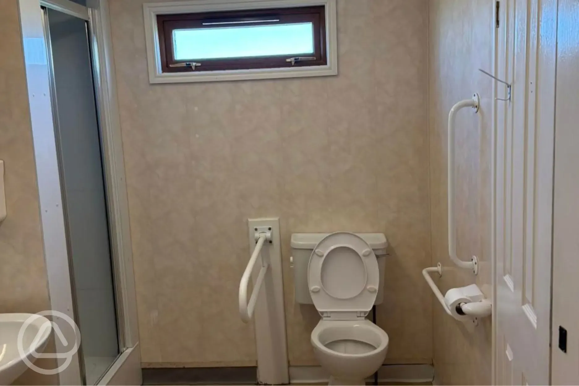 Accessible toilet and shower with handrail Accessible toilet and shower with handrail