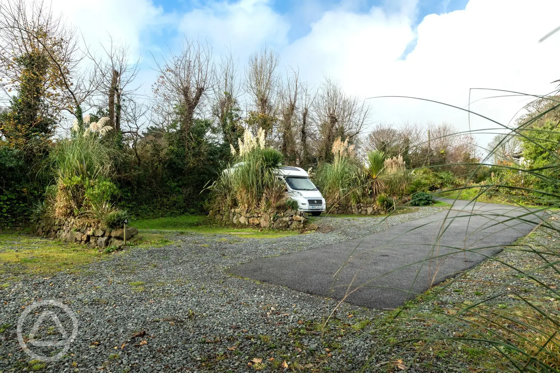 Fully serviced hardstanding pitches with privacy hedging