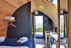 View to the dining area, TV and glass door