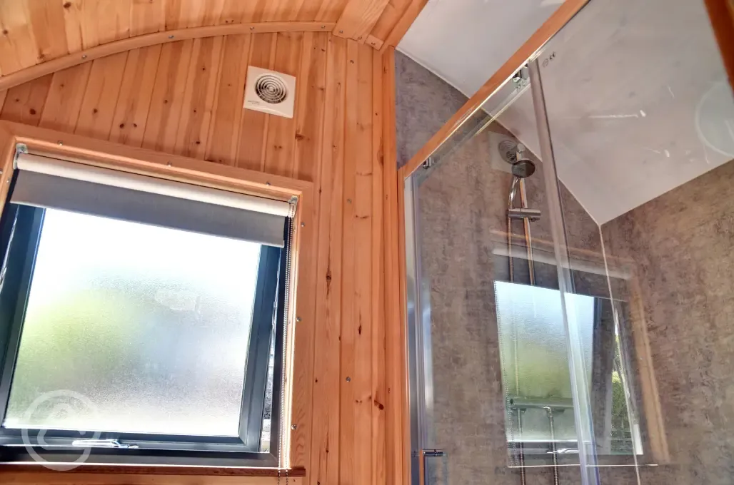 Glamping pod with hot tub shower