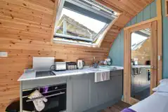 Kitchen with a toaster, kettle, oven, hob, sink and kitchen equipment