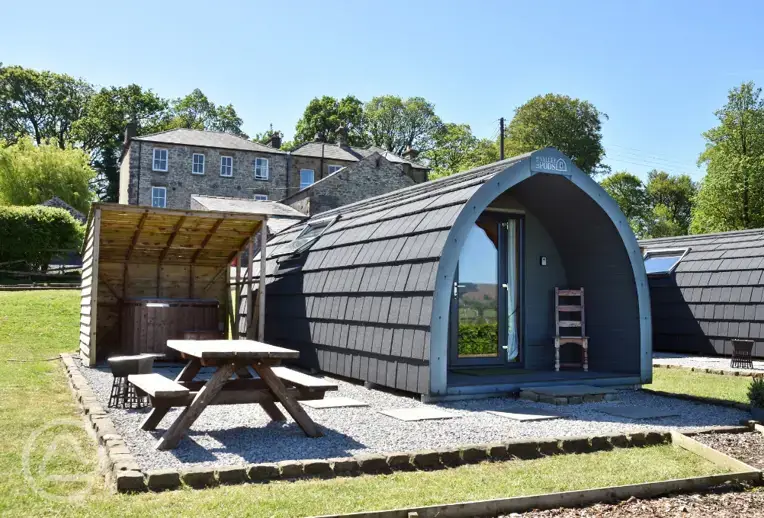 Glamping pod with hot tub exterior 