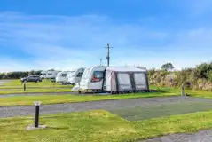 Fully serviced hardstanding pitches (17m x 8.5m) with a 10 amp hook up Fully serviced hardstanding pitches (17m x 8.5m) with a 10 amp hook up