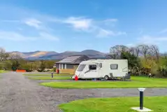 Fully serviced hardstanding pitches overlooking Snowdonia mountains Fully serviced hardstanding pitches overlooking Snowdonia mountains