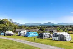Electric grass pitches with awning space at Ael y Garnedd Electric grass pitches with awning space at Ael y Garnedd