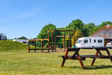 Prime location family electric hardstanding pitches beside play area