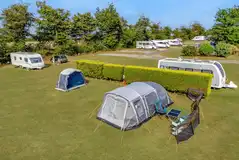 Electric grass pitches with 10 amp hook up (adults only)