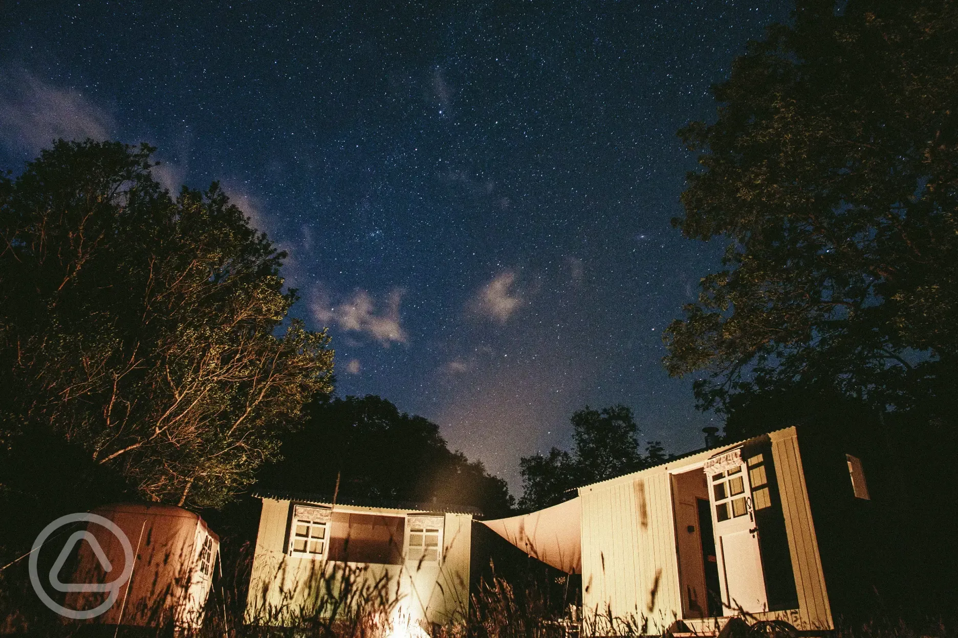 Shepherds' huts under a starry sky