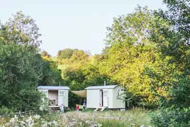 Shepherds' huts with wildflower meadow