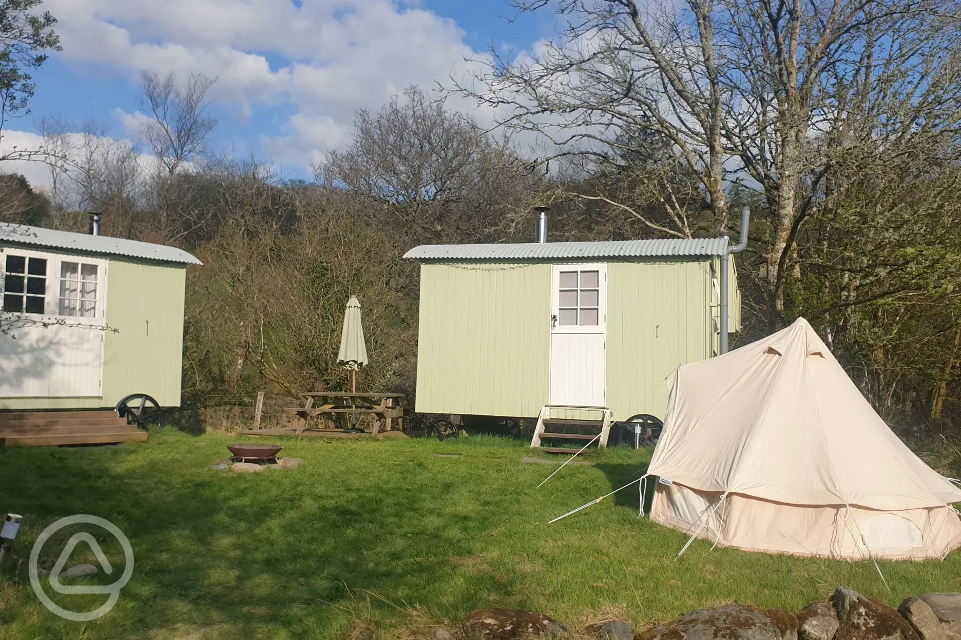 Shepherds' huts with children's bell tent