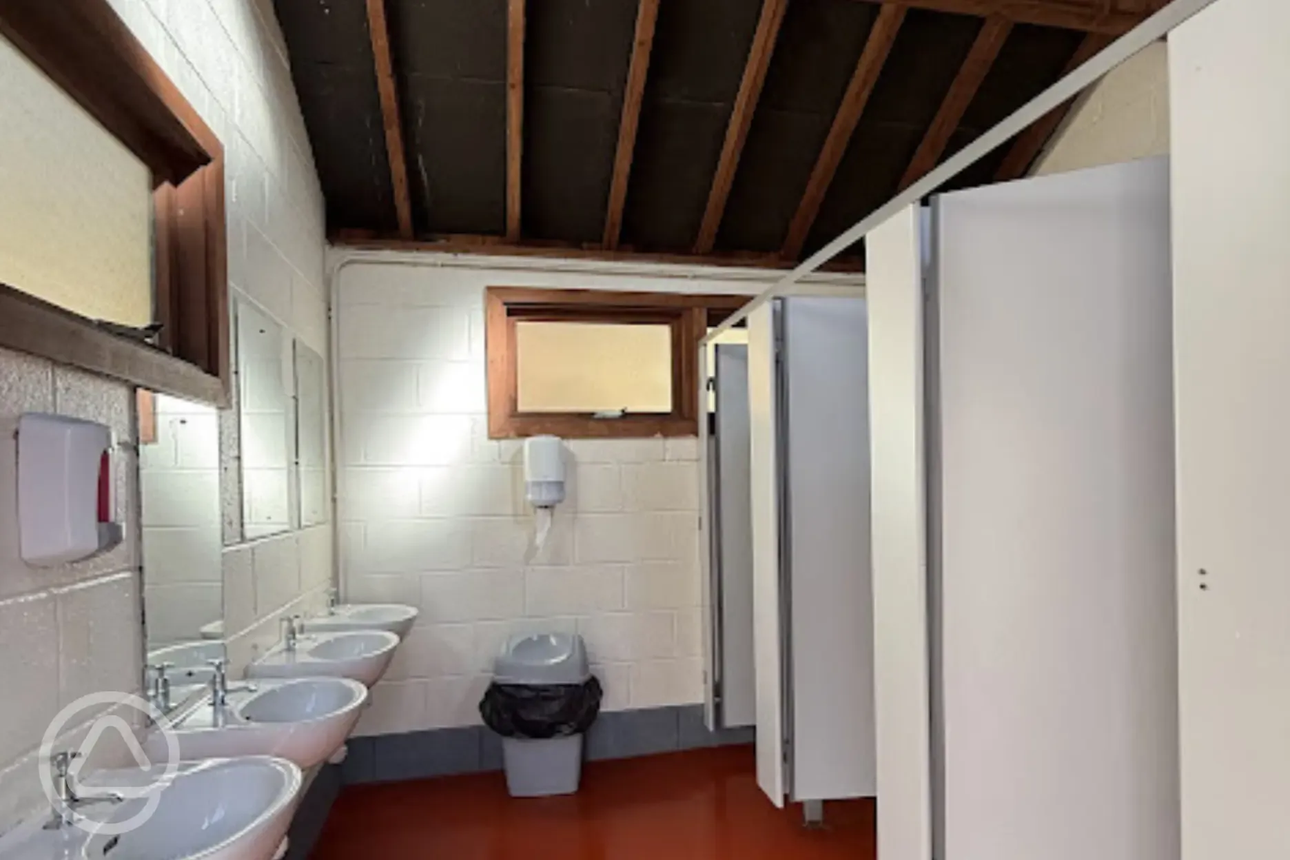 Toilets with sinks and mirrors for campers