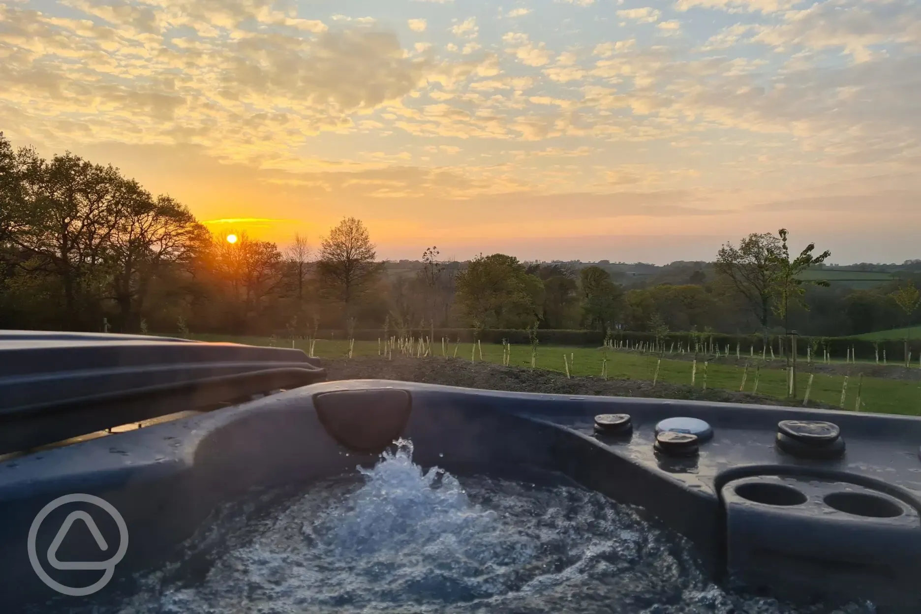 Safari tent hot tub at sunset