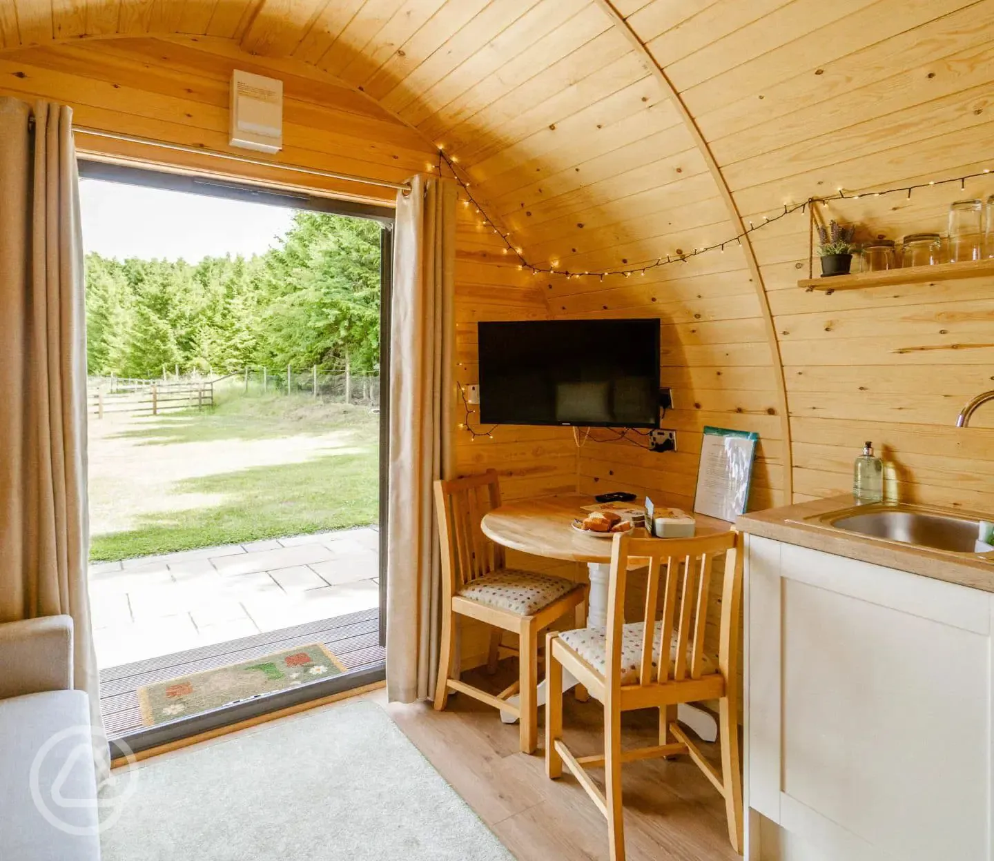 Glamping pod TV and seating area