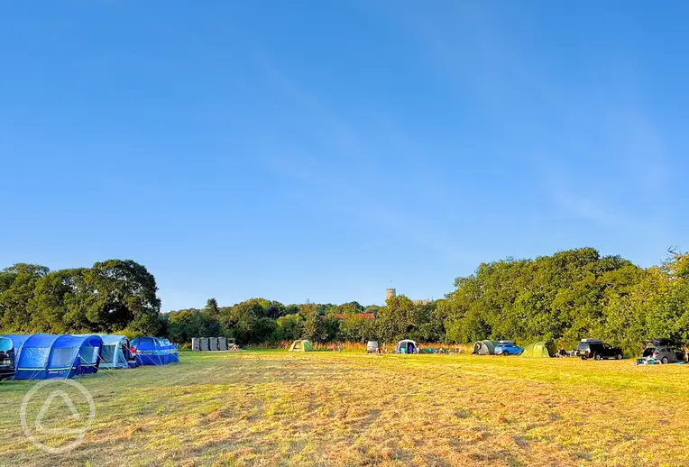 Grass pitches at Gresham Hall Glamping