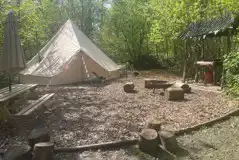 Jungle bell tent seating area and private clearing