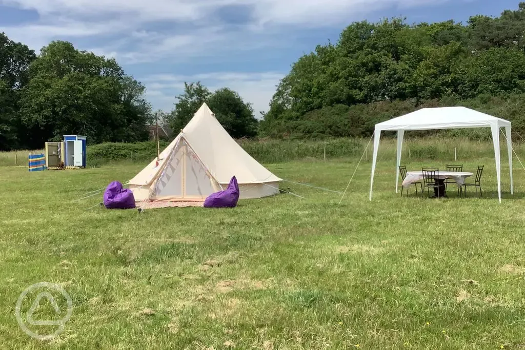 Bell tent and outdoor dining area