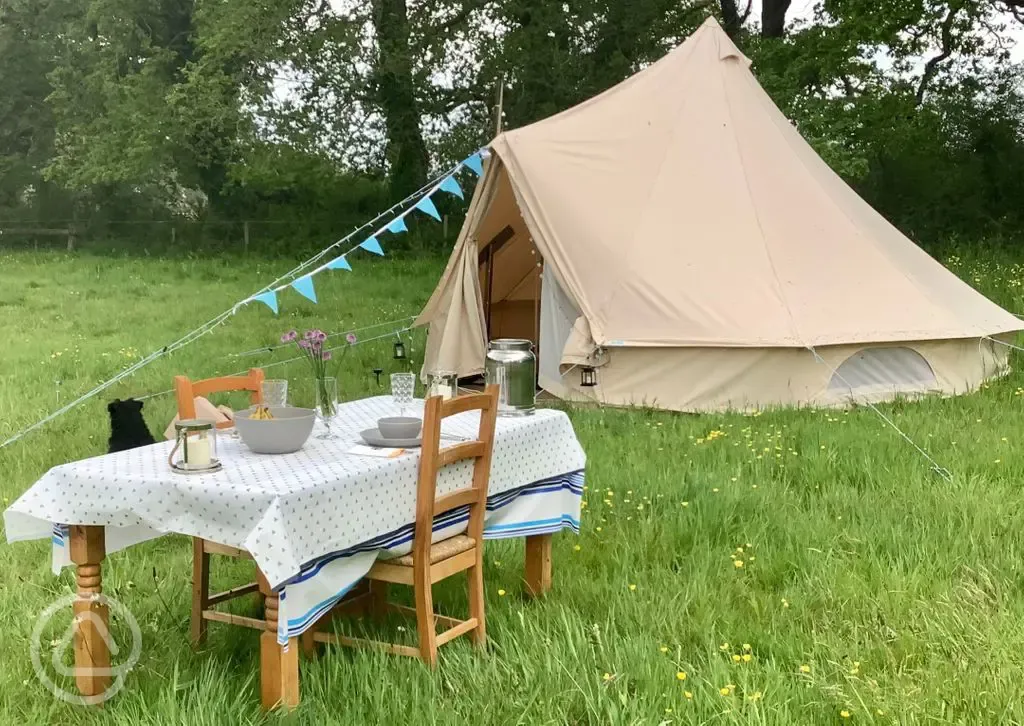 Bell tent and outdoor dining area