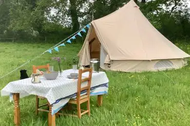 Bell tent and outdoor dining area